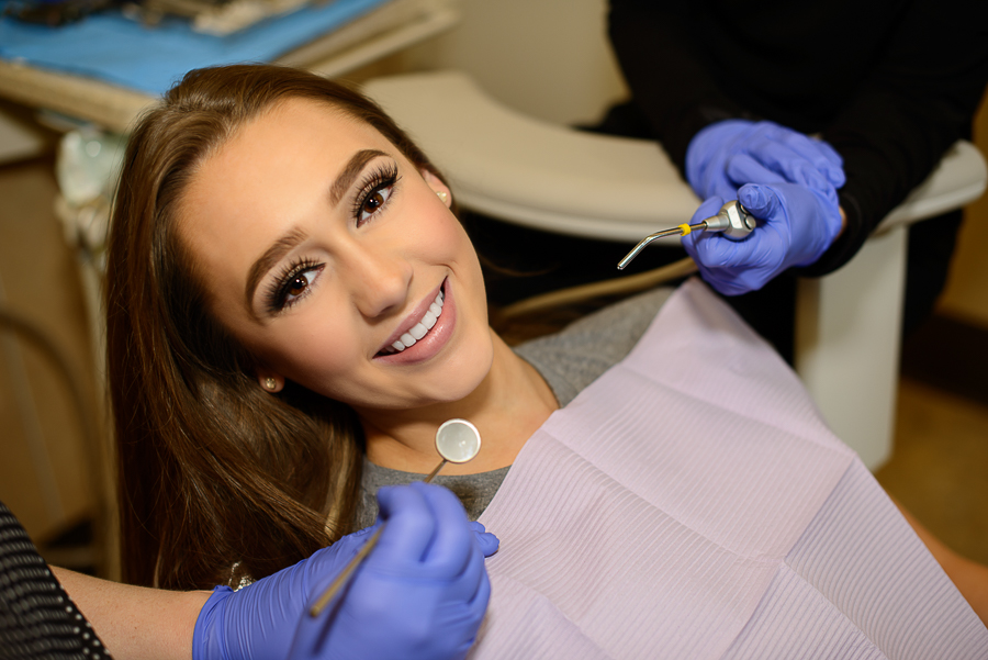 Patient waiting for her cosmetic dentistry consultation to see what treatments will enhance her smile. 
