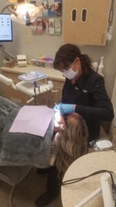 our doctors performing a dental procedure